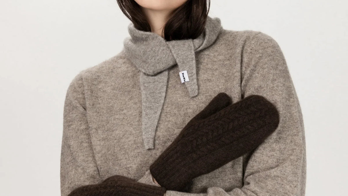 Nome model wearing Guna Scarf and Noyon sweater in Gray