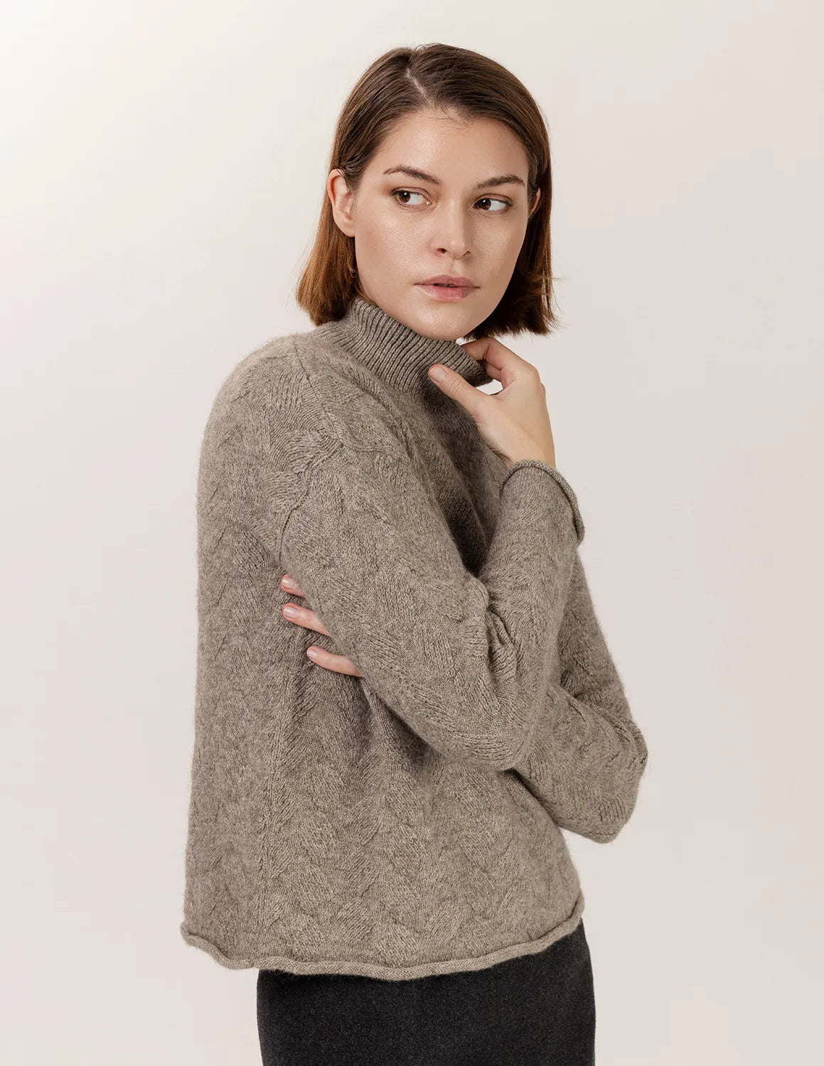 Woman wearing a gray sweater against a plain background - Natural Grey