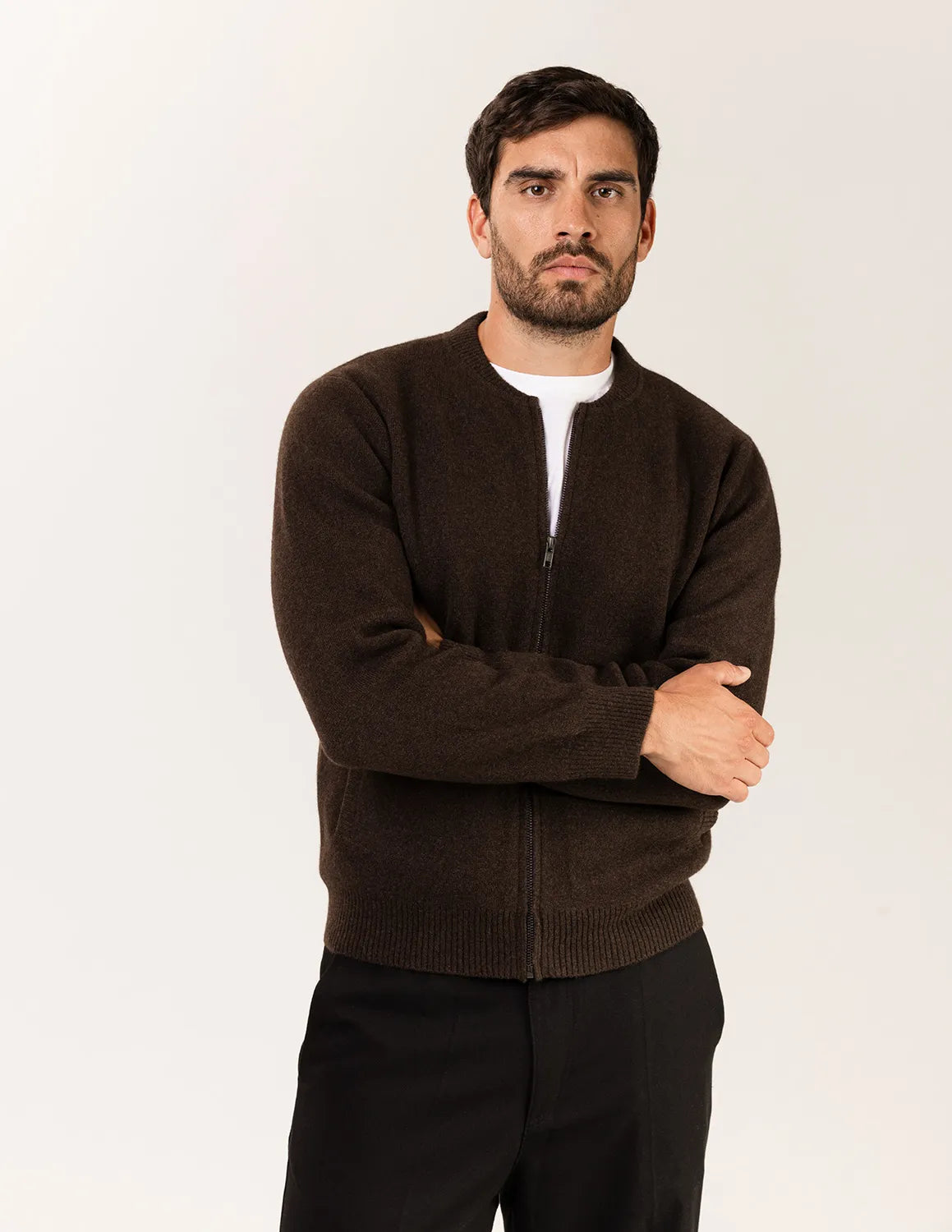 Man wearing a brown sweater over a white shirt on a beige background - Natural Brown
