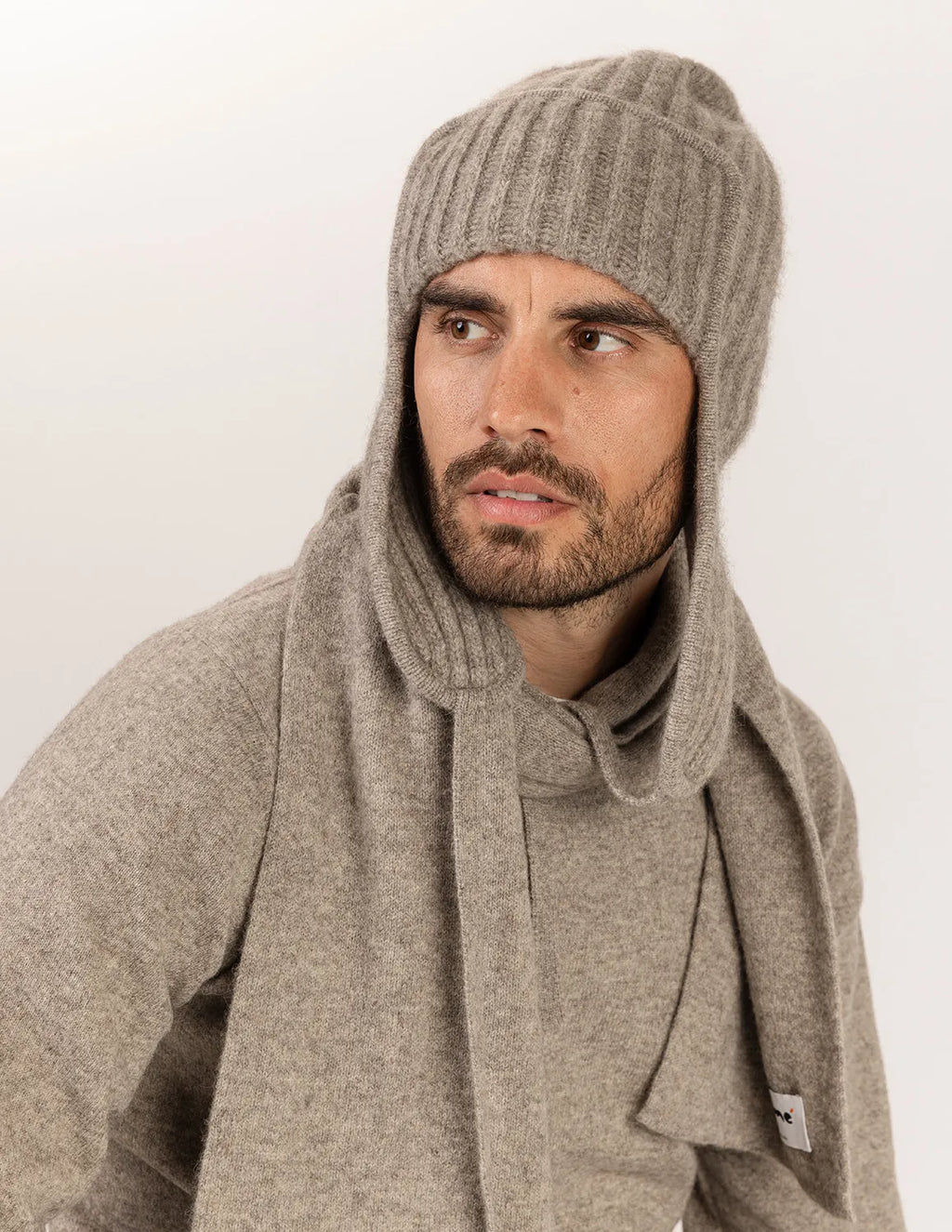 Man wearing a gray knit beanie and scarf on a white background - Natural Grey 