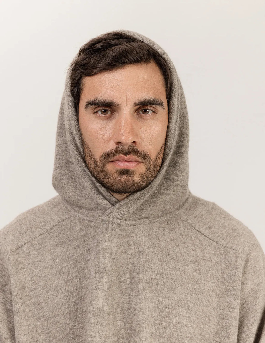 Man wearing a beige hoodie against a plain background - Natural Grey
