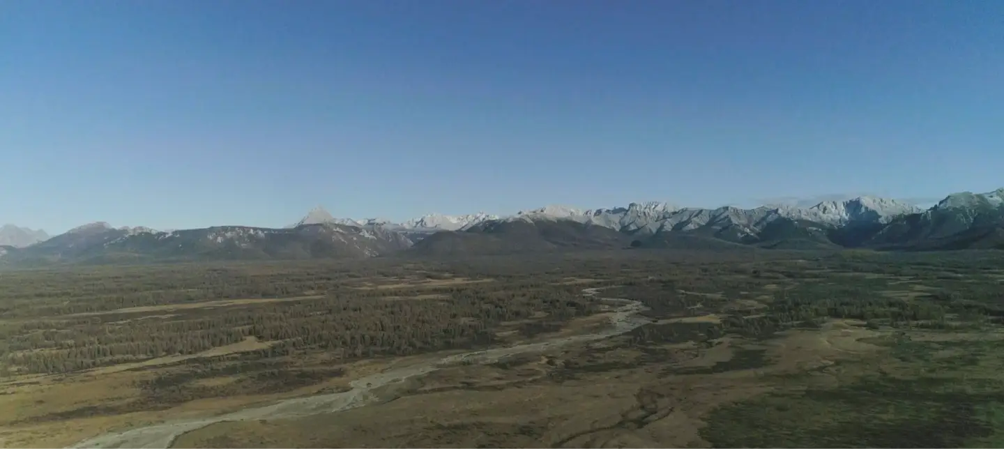 Scenic view of a mountain range with a clear blue sky