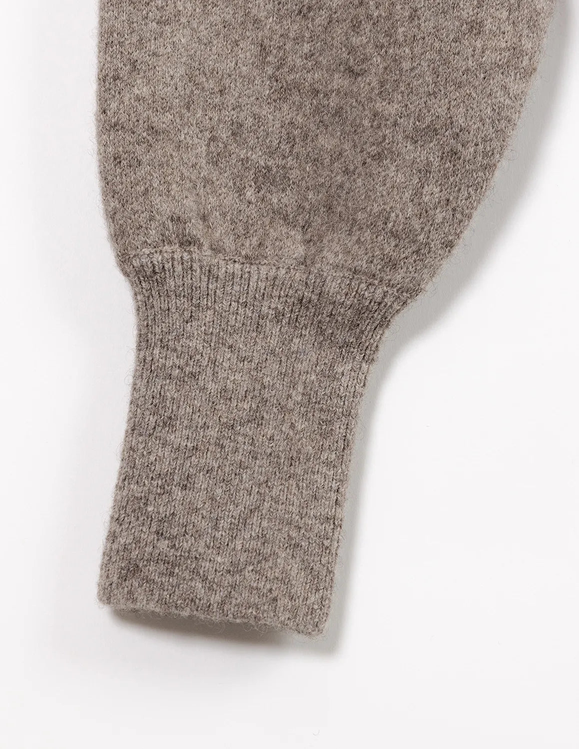 Close-up of a gray knitted sweater sleeve on a white background - Natural Grey