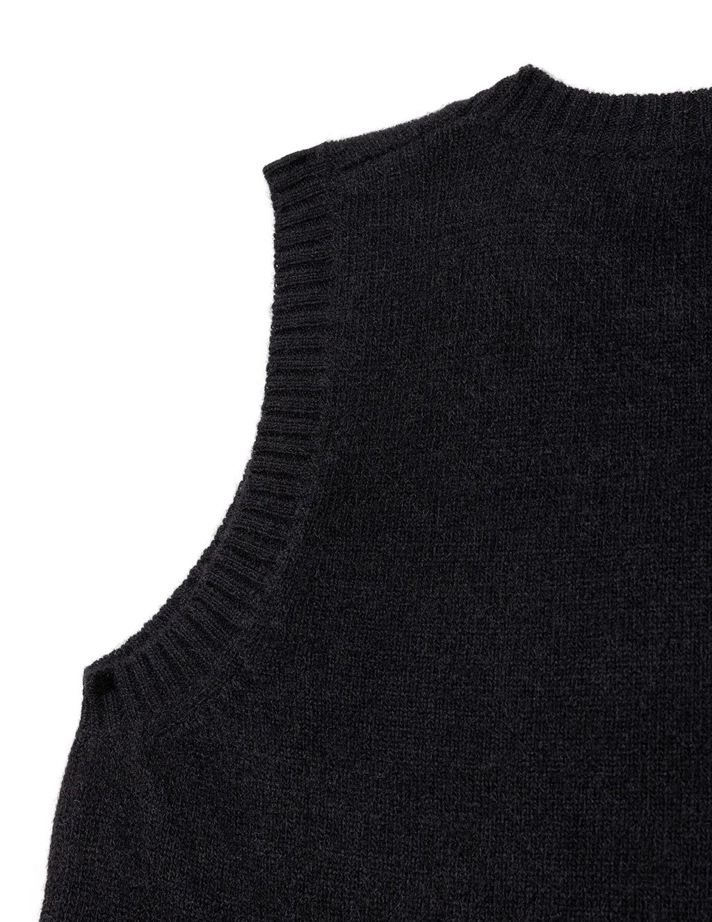 Black sleeveless sweater on a white background