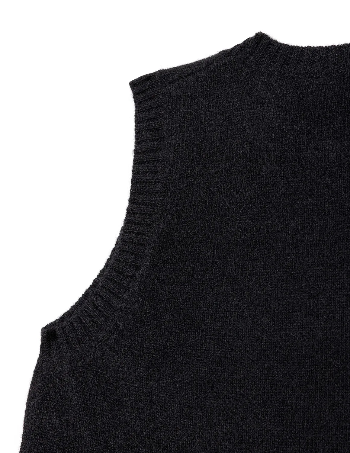 Black sleeveless sweater on a white background