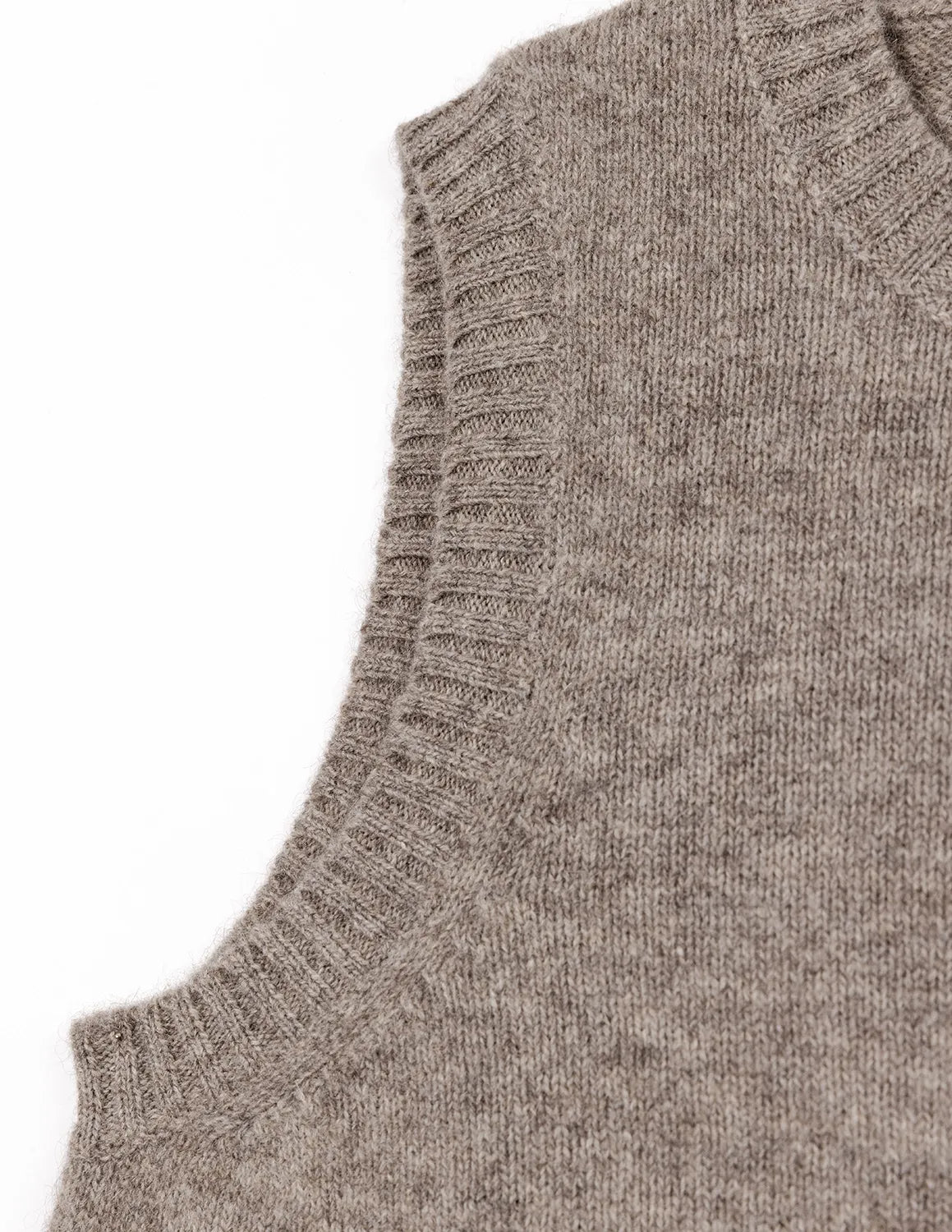 Close-up of a gray knitted sleeveless sweater on a white background - Natural Grey