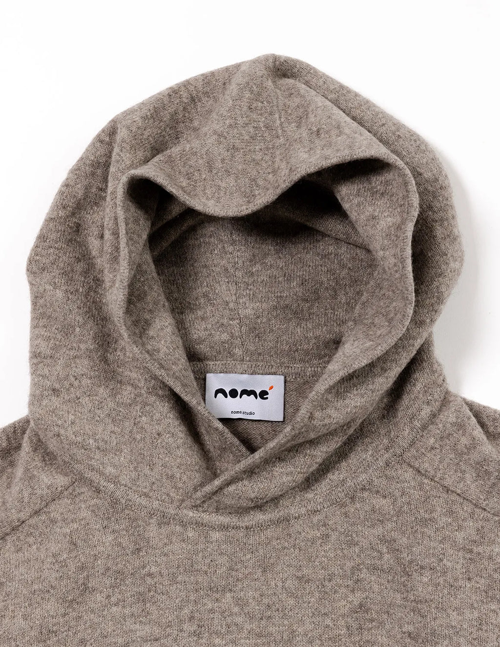 Close-up of a gray hoodie with a visible brand label on a white background - Natural Grey