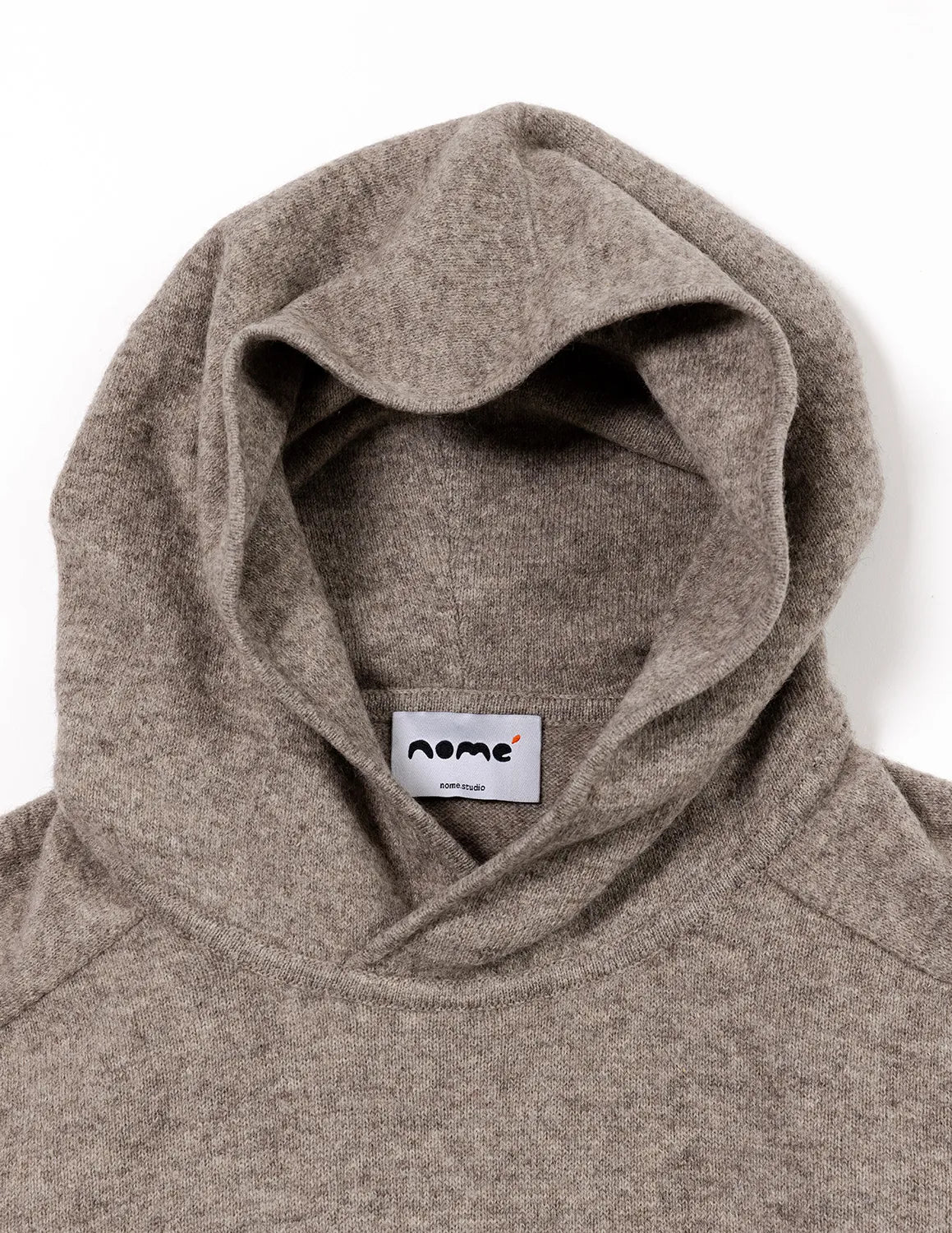 Close-up of a gray hoodie with a visible brand label on a white background - Natural Grey